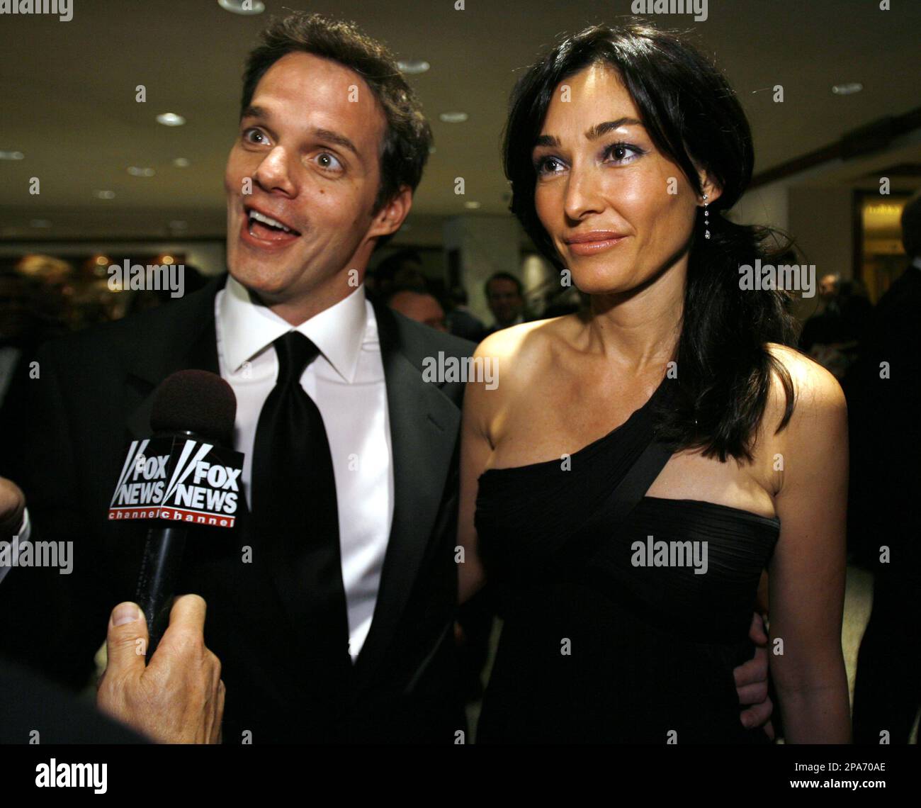 TV host Bill Hemmer and Dora Tomanovich talk with a reporter as they arrive  for the White House Correspondents' Association dinner in Washington  Saturday, April 26, 2008.(AP Photo/Jose Luis Magana Stock Photo -