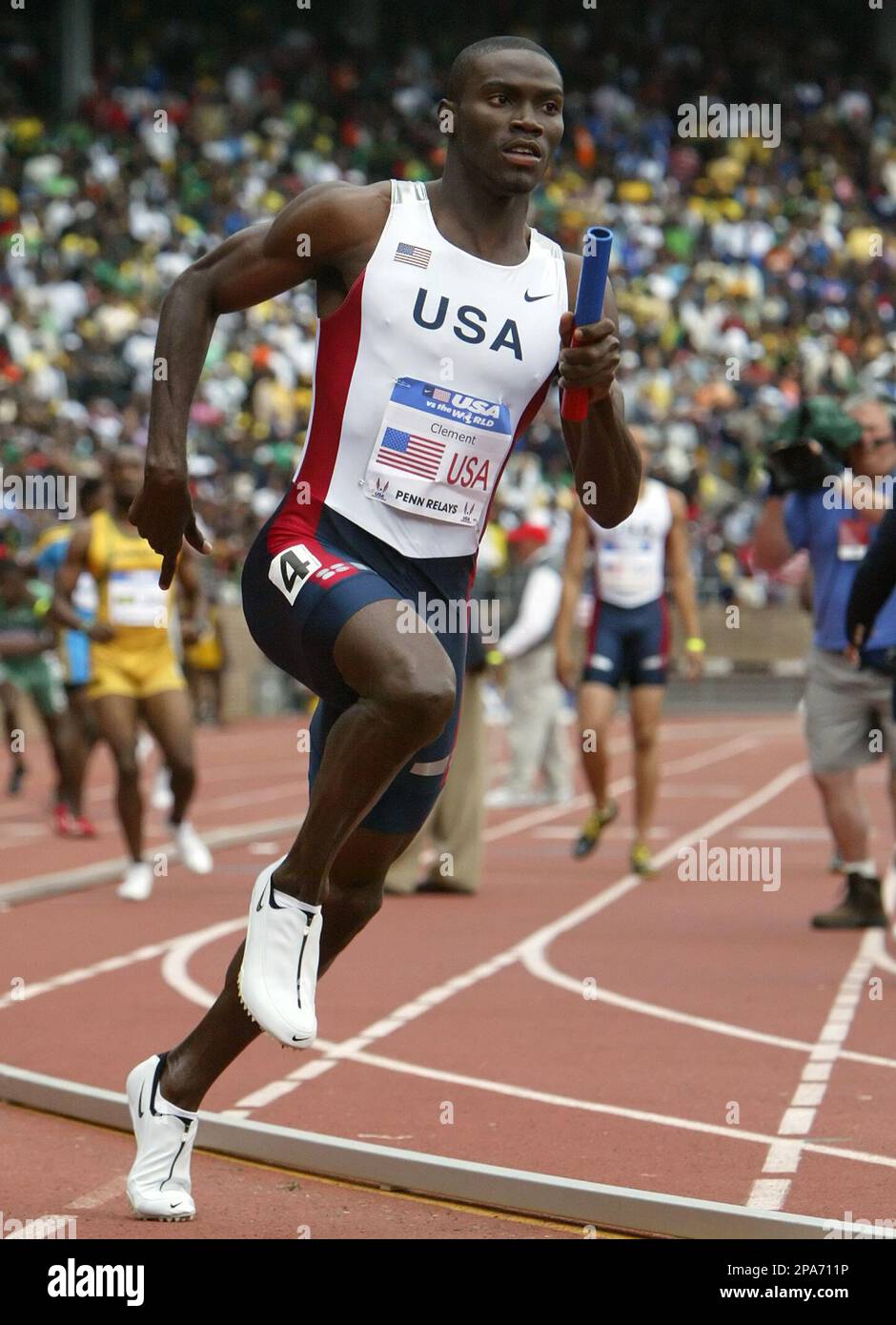 Team USA member Kerron Clement runs the third leg of the Olympic