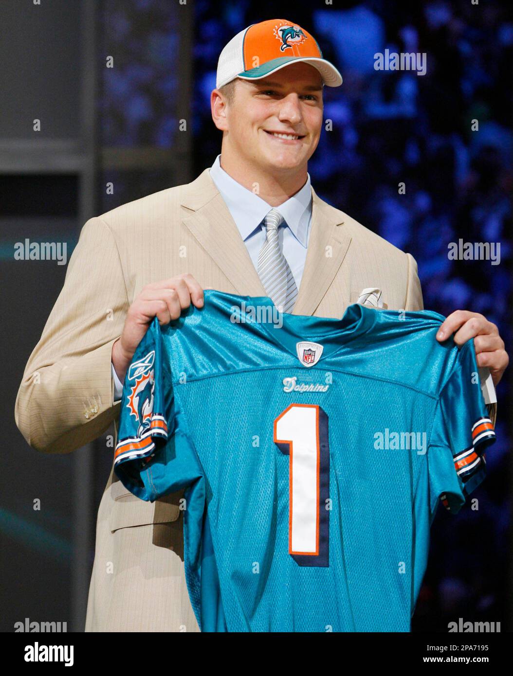 Jake Long of Michigan holds up a Miami Dolphins jersey after being  announced as the number one pick in the NFL Draft Saturday, April 26, 2008  in New York. (AP Photo/Jason DeCrow