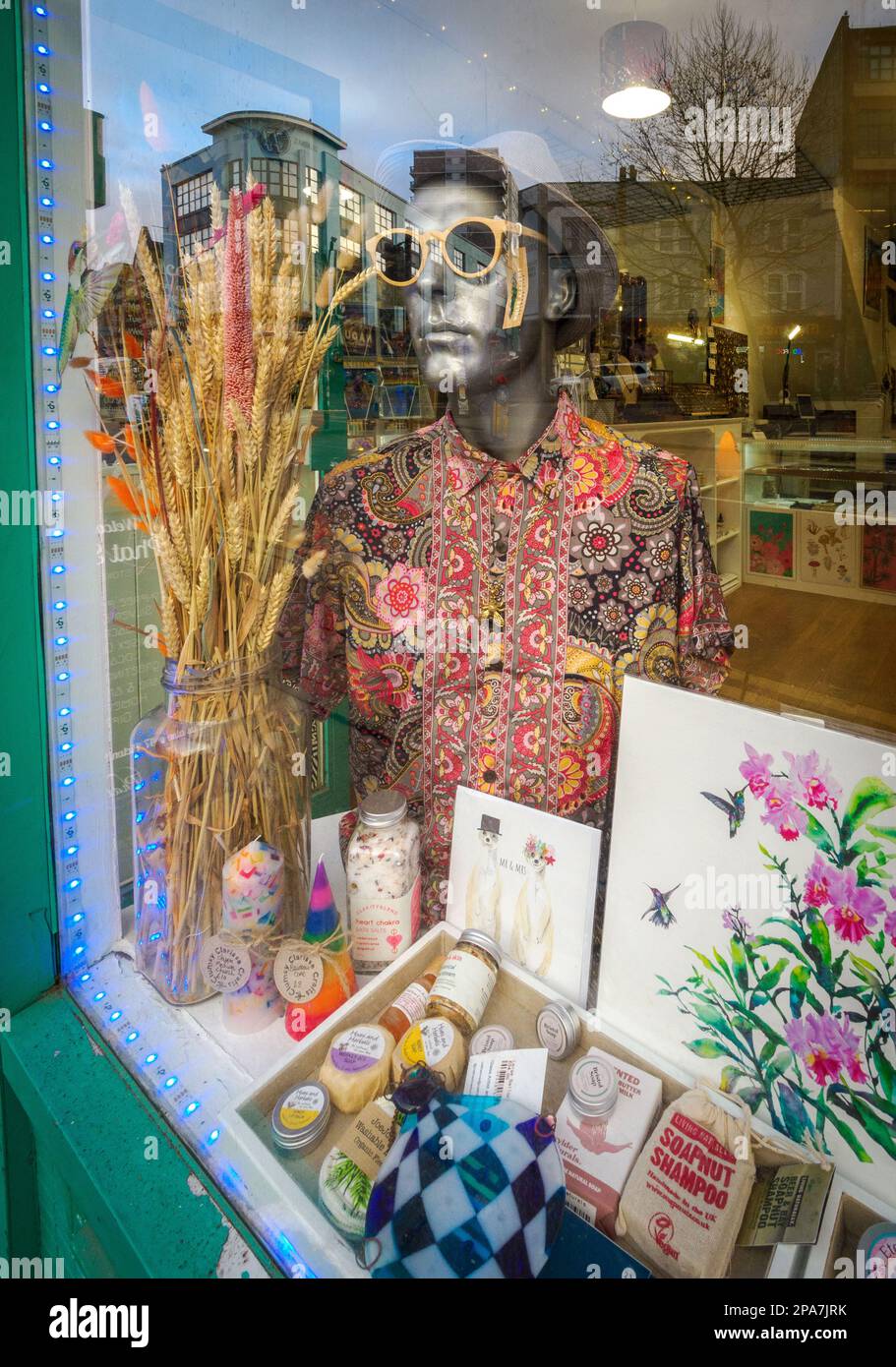 Gift shop window in a Bristol UK street with cool mannequin wearing shades Stock Photo