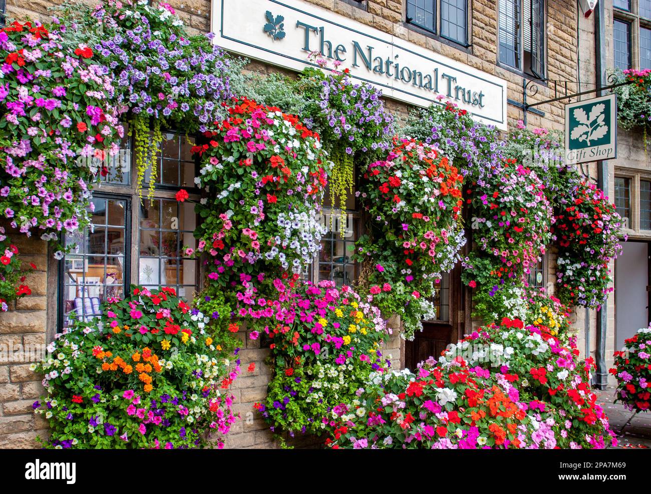 Flowery facade of the National Trust shop in Wells Somerset UK Stock Photo