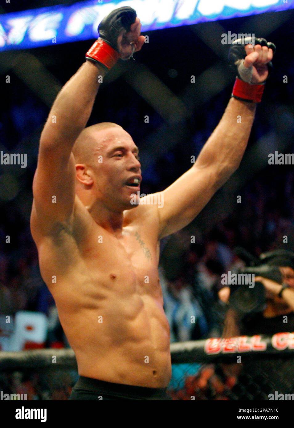 Georges St-Pierre, from Montreal, celebrates after defeating Matt Serra ...