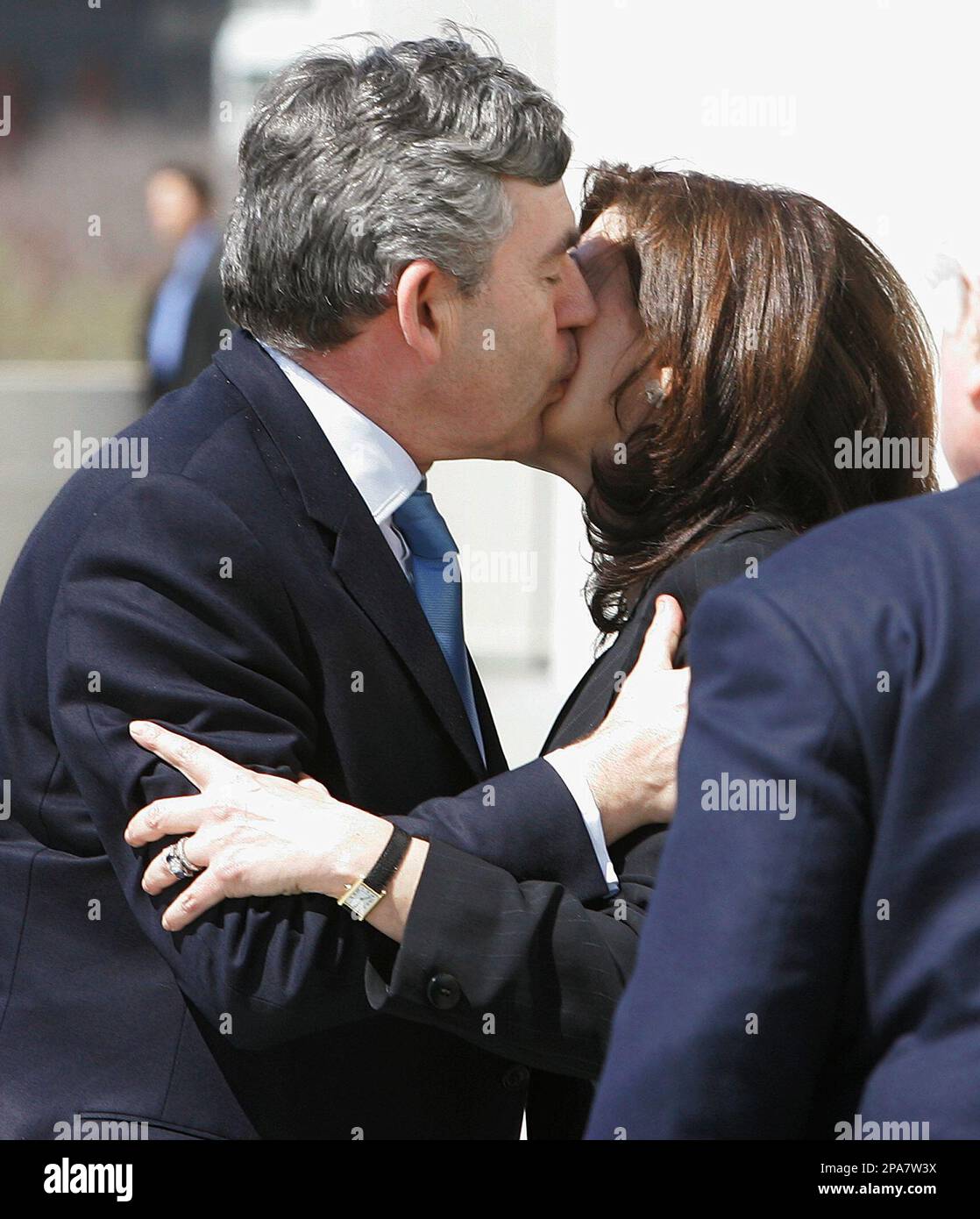 British Prime Minister Gordon Brown kisses Victoria Anne Reggie, Sen. Edward Kennedys wife, upon his arrival at the John F