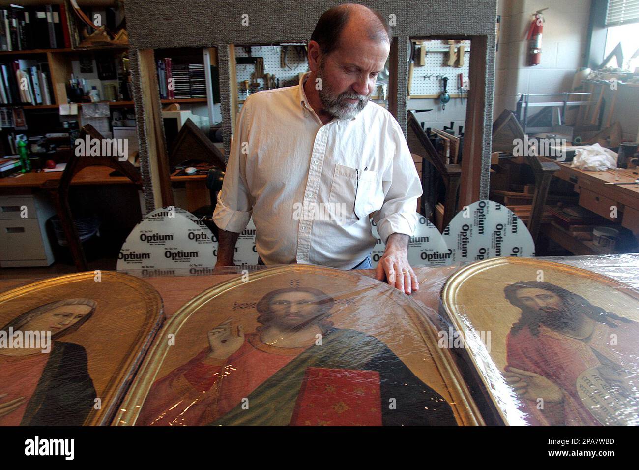 North Carolina Museum of Art conservator David Beaudin inspects the