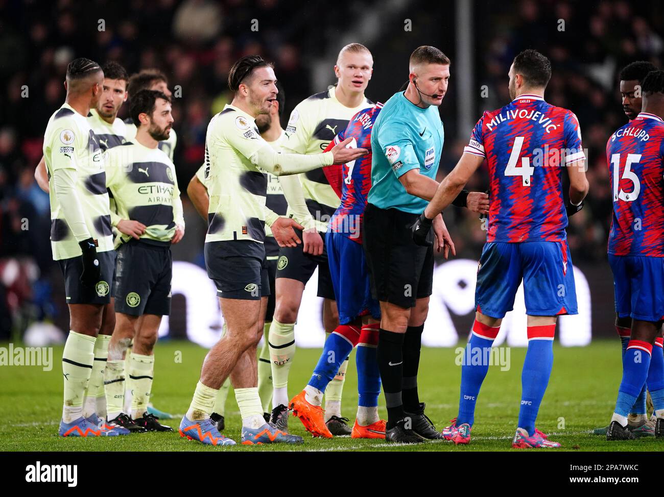 Manchester City's Jack Grealish reacts to a decision as referee Robert Jones speaks to Crystal Palace's Luka Milivojevic during the Premier League match at Selhurst Park, London. Picture date: Saturday March 11, 2023. Stock Photo