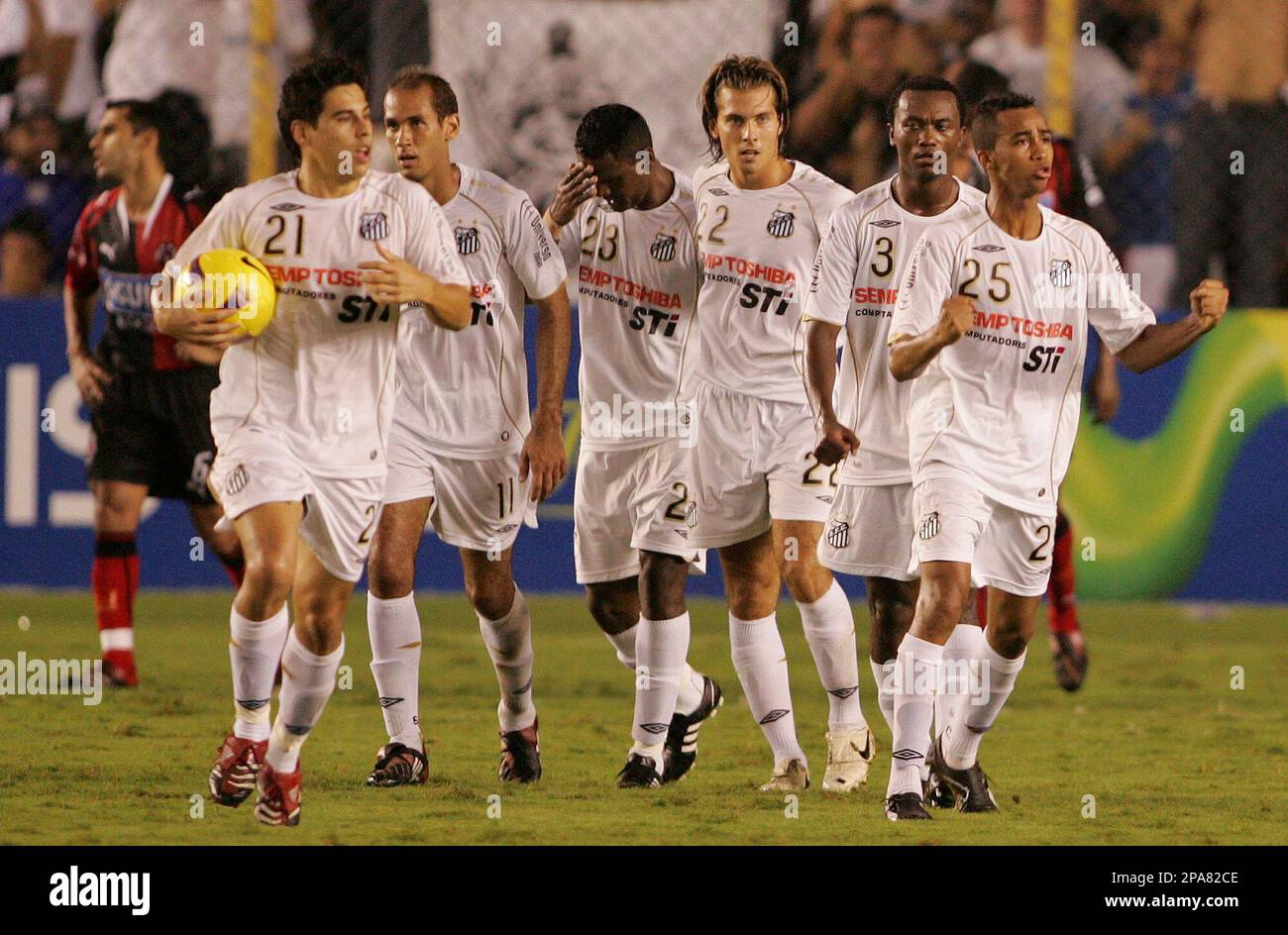 Brazil's Santos' players, from left, Mauricio Molina, Rodrigo Souto, Kleber  Pereira, Mariano Tripodi, Kleber, and Wesley, celebrate after scoring  against Colombia's Cucuta Deportivo during a Copa Libertadores soccer game  in Santos, Brazil