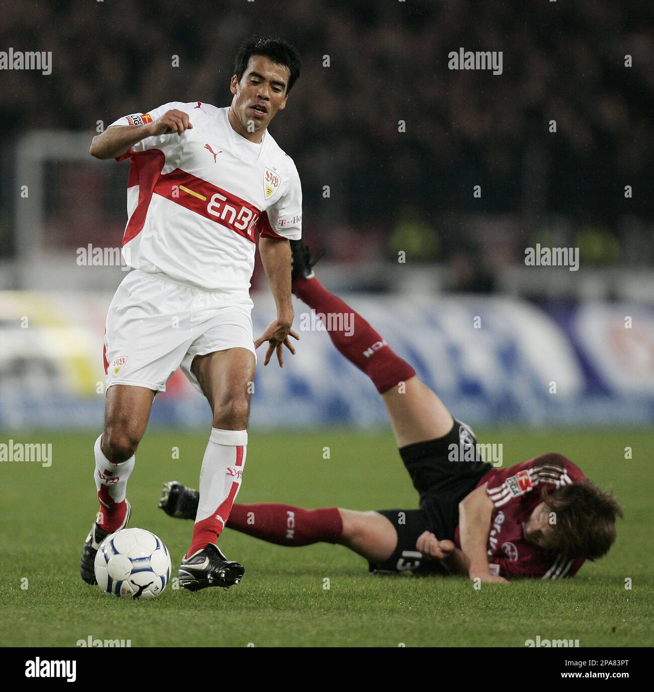 Stuttgart's Pavel Pardo, left, challenges for the ball with Nuremberg's Ivan Saenko during the German first division Bundesliga soccer match between VfB Stuttgart and 1. FC Nuremberg in Stuttgart, Germany, on Wednesday, April 16, 2008. (AP Photo/Daniel Maurer) ** NO MOBILE USE UNTIL 2 HOURS AFTER THE MATCH, WEBSITE USERS ARE OBLIGED TO COMPLY WITH DFL-RESTRICTIONS, SEE INSTRUCTIONS FOR DETAILS ** Stock Photo