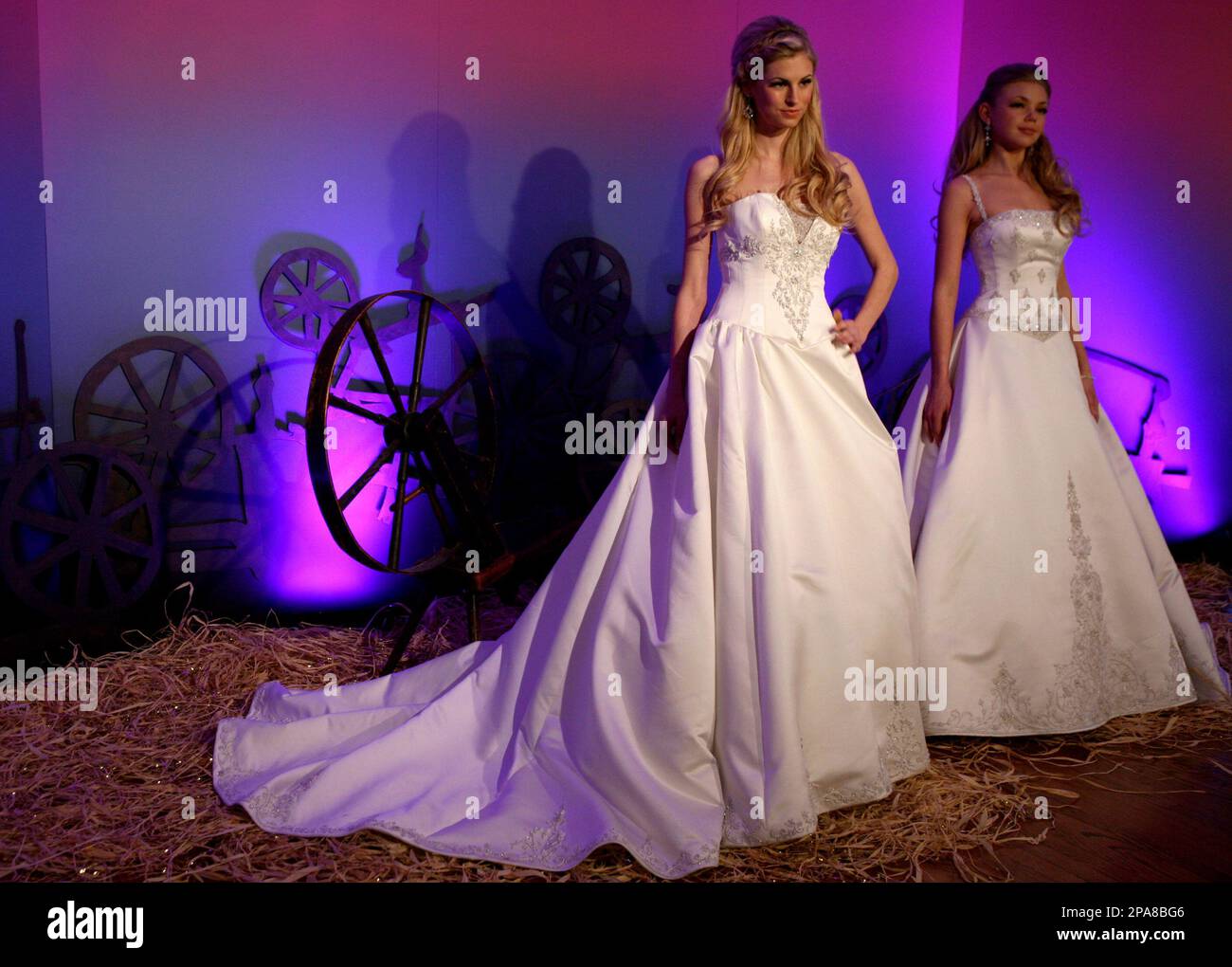 Models wear Sleeping Beauty gowns designed by Kirstie Kelly for Disney s Fairy Tale Weddings collection Sunday April 13 2008 during Bridal Fashion Week in New York. AP Photo Diane Bondareff Stock Phot...