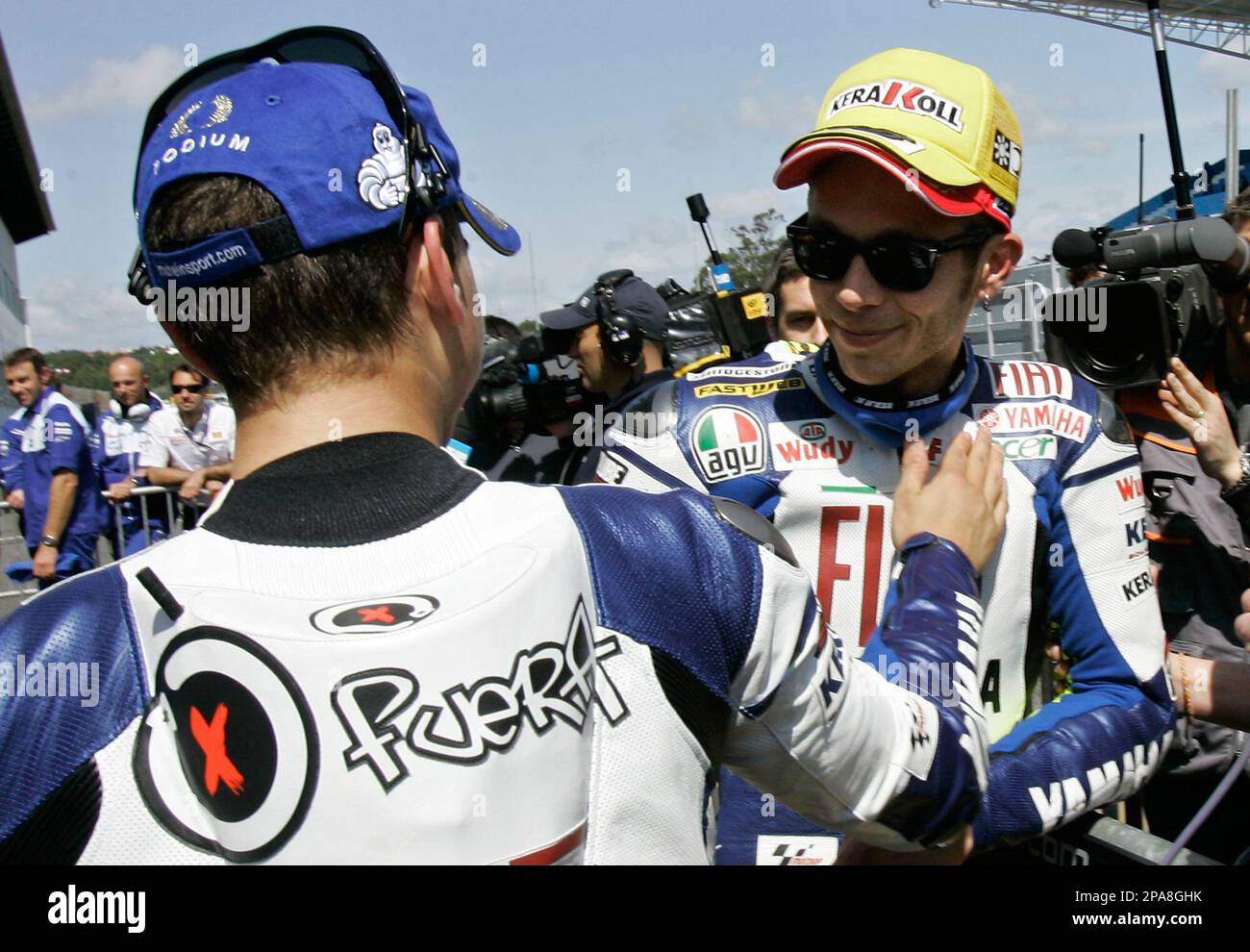 Yamaha MotoGP rider Jorge Lorenzo, left, from Spain, reacts with teammate  Valentino Rossi, from Italy, Saturday, April 12, 2008, at the end of  qualifying for Sunday's Portugal Motorcycling Grand Prix at the