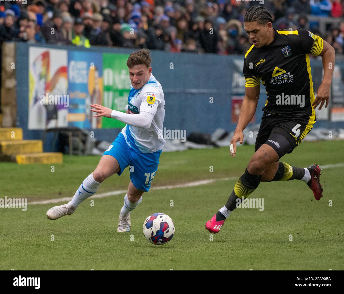 Barrow's Robbie Gotts in action with Sutton's Coby Rowe during the Sky Bet League 2 match between Barrow and Sutton United at the Holker Street, Barrow-in-Furness on Saturday 11th March 2023. (Photo: Ian Allington | MI News) Credit: MI News & Sport /Alamy Live News Stock Photo