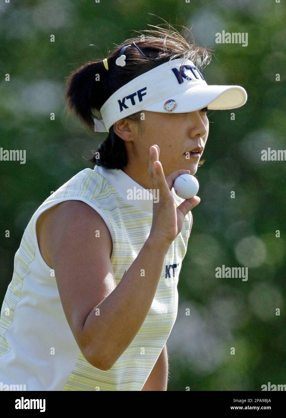 Mi Hyun Kim of South Korea waves to the crowd on the 15th hole during ...