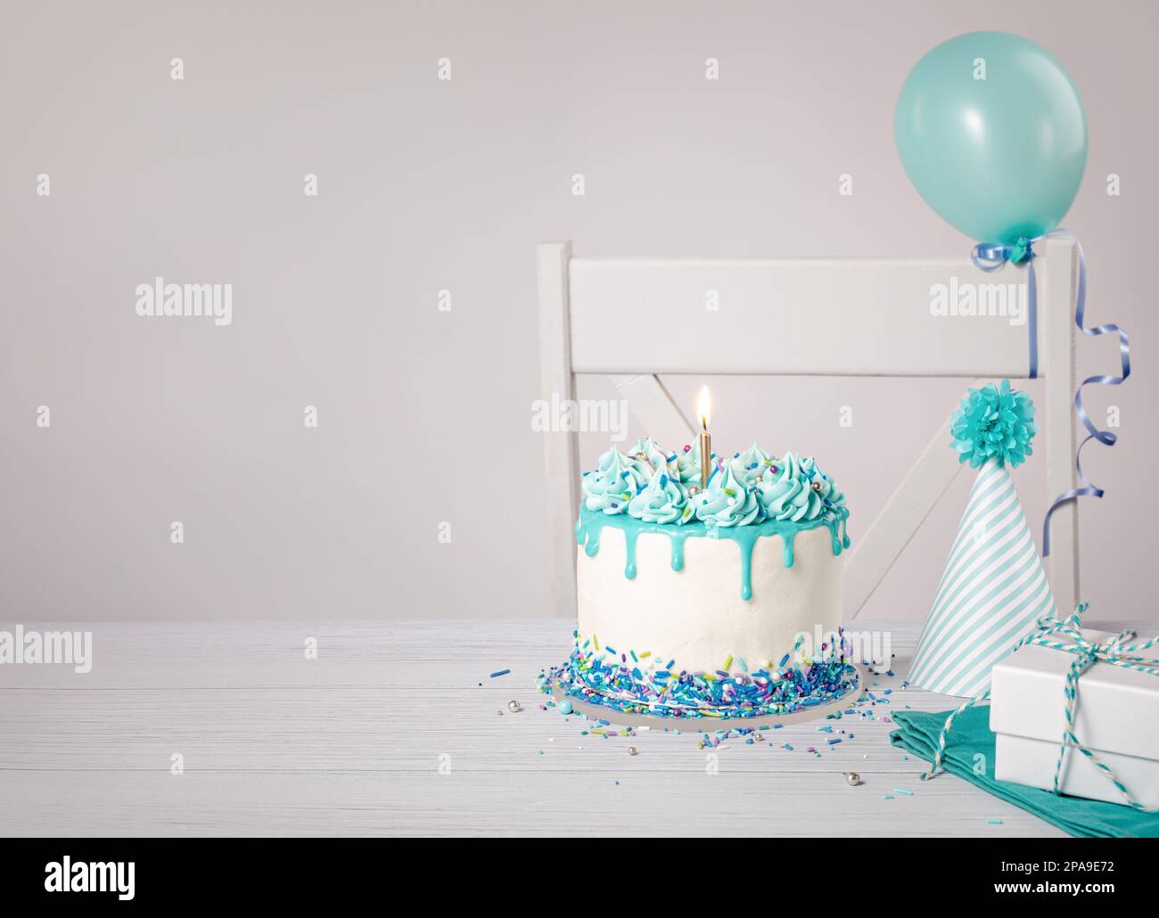 Blue and white birthday party with a buttercream drip cake, sprinkles ...