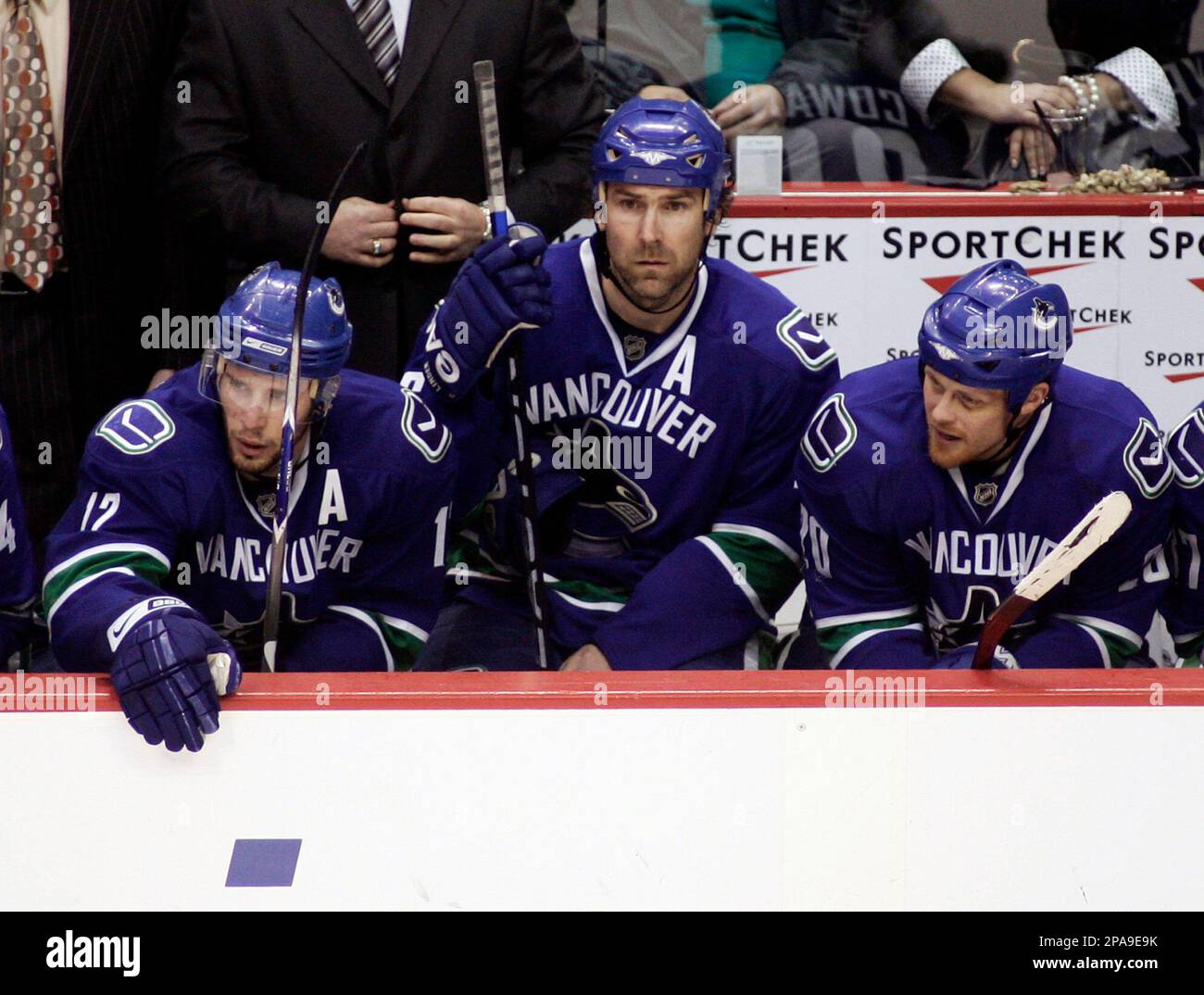 Vancouver Canucks Ryan Kesler, left to right, Trevor Linden, and Jeff Cowan watch the final seconds tick off the clock as they go on to lose to the Edmonton Oilers 2-1 during
