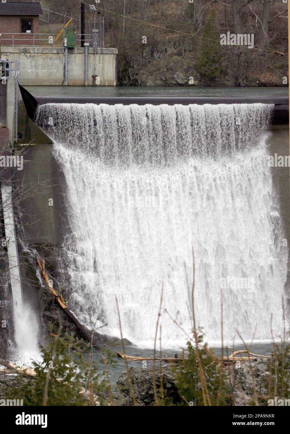 Water cascades over the dam on the Winooski River in Essex Junction, Vt., Tuesday, April 1, 2008