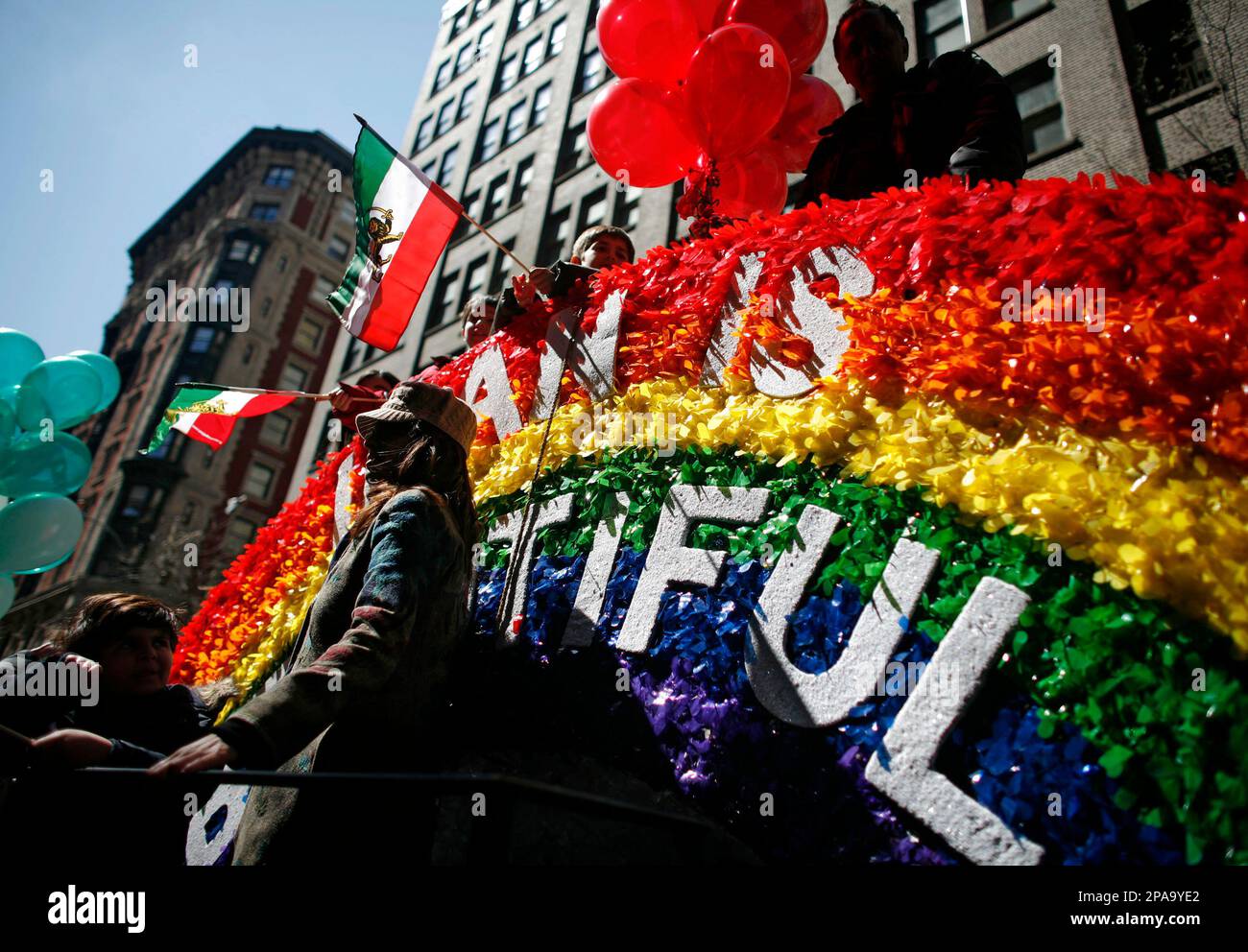 A float bearing the slogan "Iran is Beautiful" makes its way down