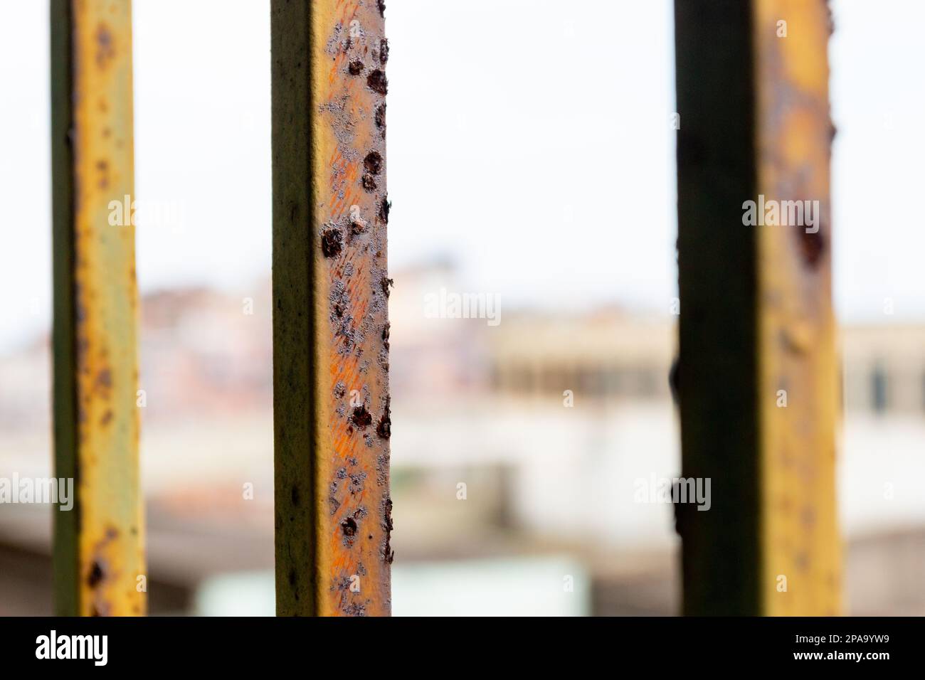 rusty railings with Cantagalo Hill in the background in Rio de Janeiro ...