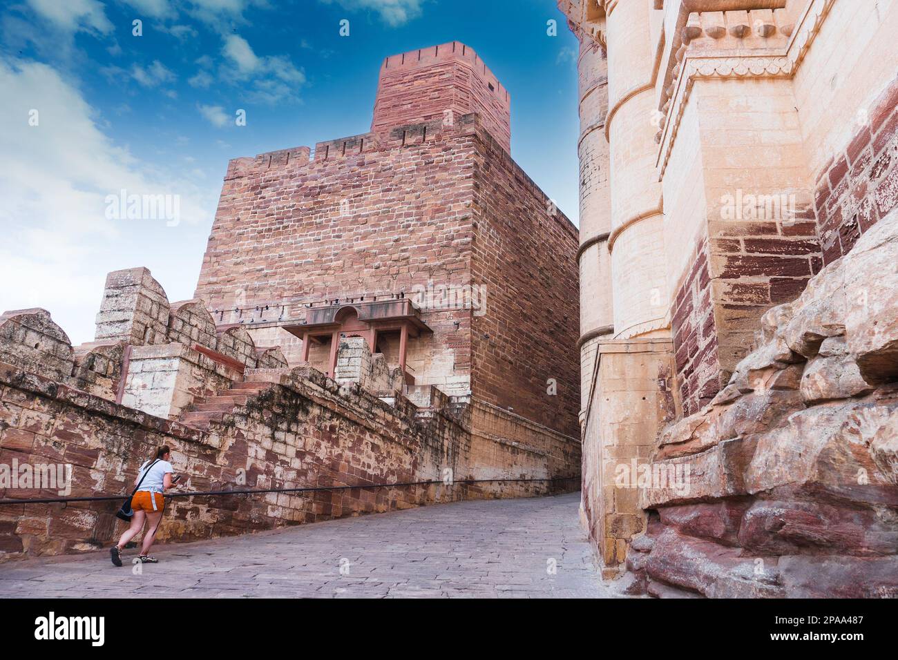 Jodhpur, Rajasthan, India - 19th October 2019 : Foreigner woman tourist climbing up famous Mehrangarh fort, Mehrangarh Fort is UNESCO heritage site. Stock Photo