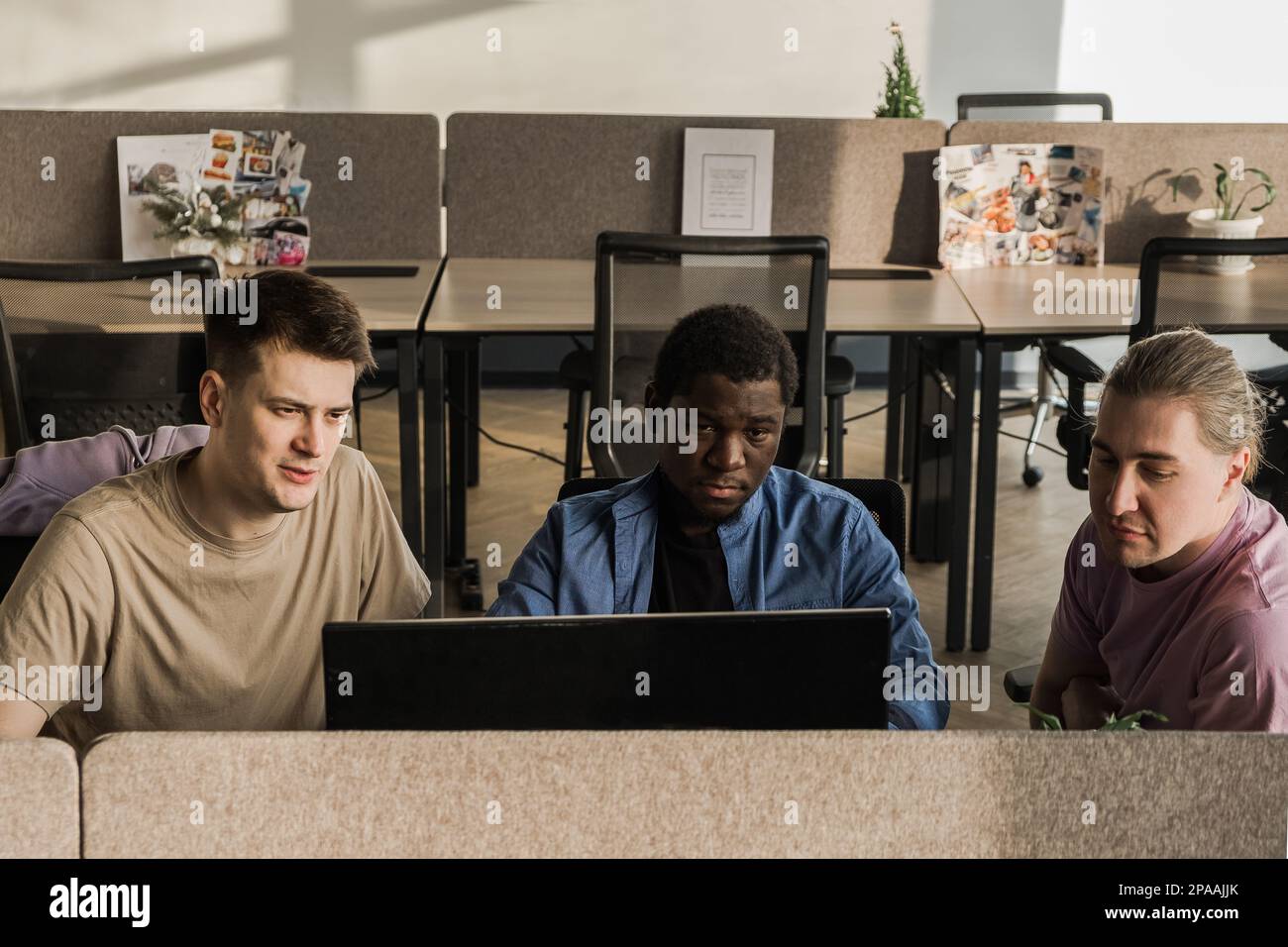 Programmers working in the office of a software development company. Coding technologies, site design. Successful diverse Teamwork. Cyberspace concept Stock Photo