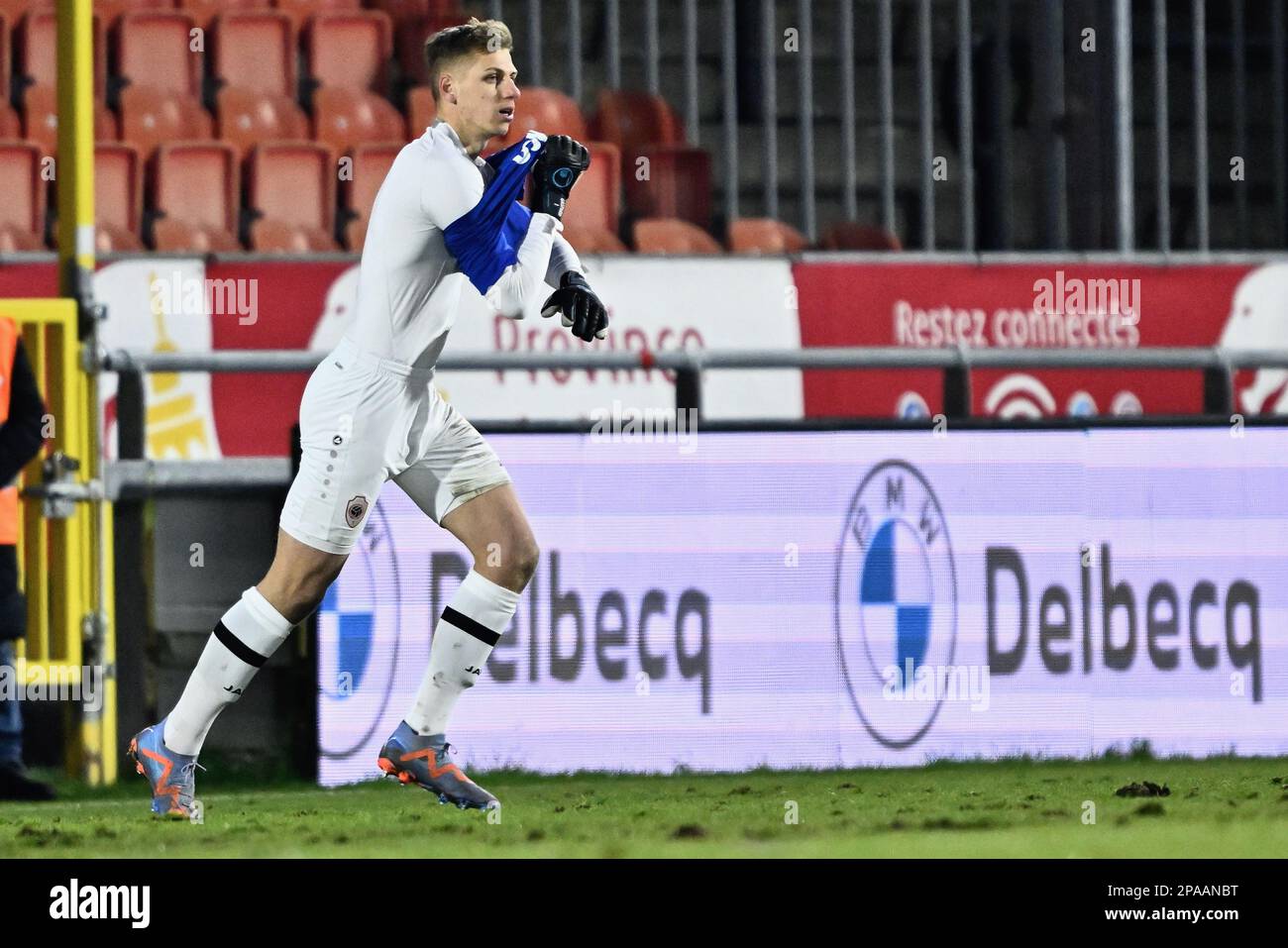 Antwerp's goalkeeper Jean Butez changes shirt during a soccer match