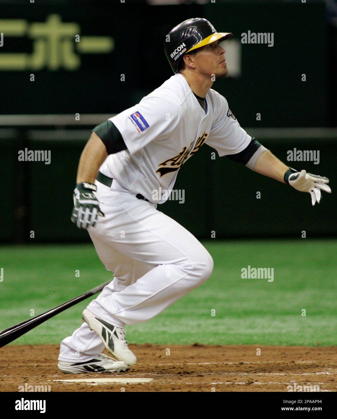 Oakland Athletics utilityman Donnie Murphy heads to first base after hitting a grand slam off Hanshin Tigers Jeff Williams in the eighth inning of their exhibition baseball game at Tokyo Dome in