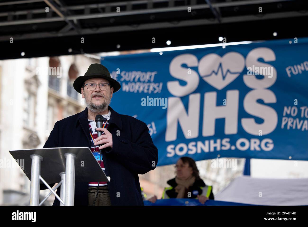 Professor Philip Banfield, a Consultant Obstetrician and Gynecologists' in North Wales and the Council Chair of the British Medical Association, is seen giving a speech during the demonstration. SOS NHS campaign group and other trade unions organised a march from University College London Hospital to Downing Street to demand emergency funding for the National Health Service (NHS) from the UK Government to support services and staff and not to privatise the healthcare sector ahead of the Chancellor's spring budget on 15th March 2023. Stock Photo