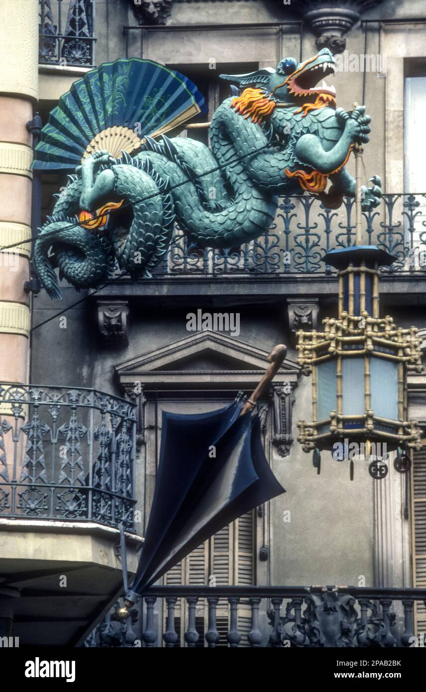 Chinese dragon on Casa Bruno Cuadros in Place de la Boqueria in Barcelona, Spain.  The building was remodelled in 1883 by the architect Josep Vilaseca and reflects the taste at the time for oriental decoration. Stock Photo