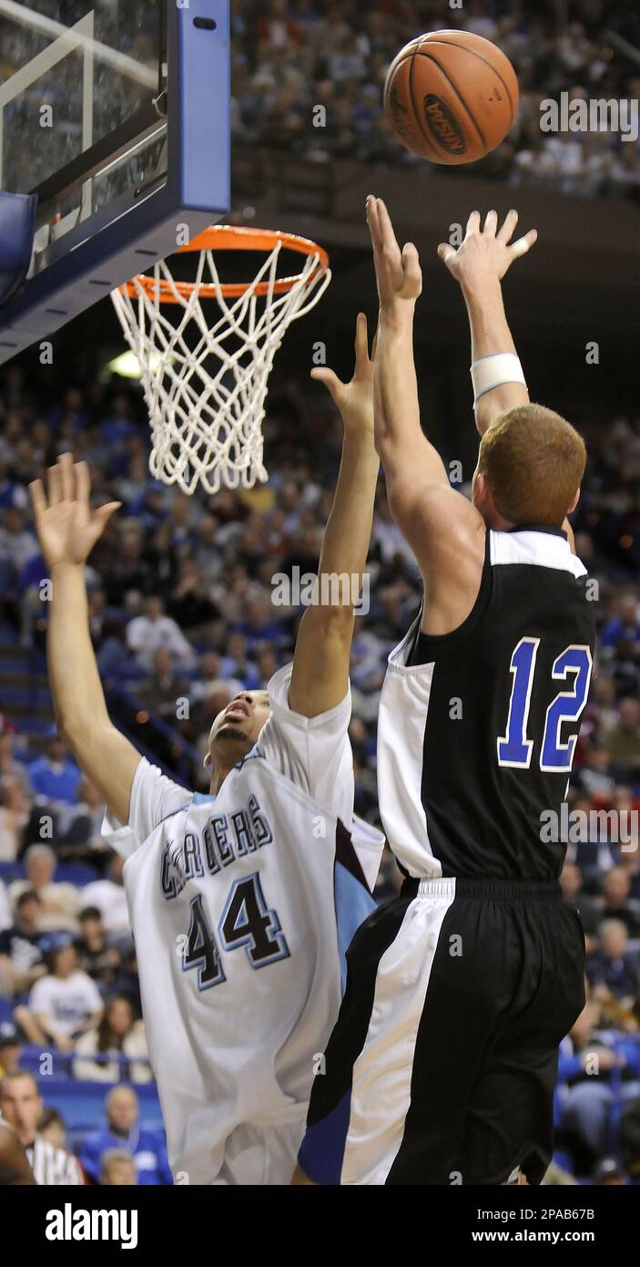 Paintsville's Landon Slone shoots over Jeffersontown's Brandon Cason