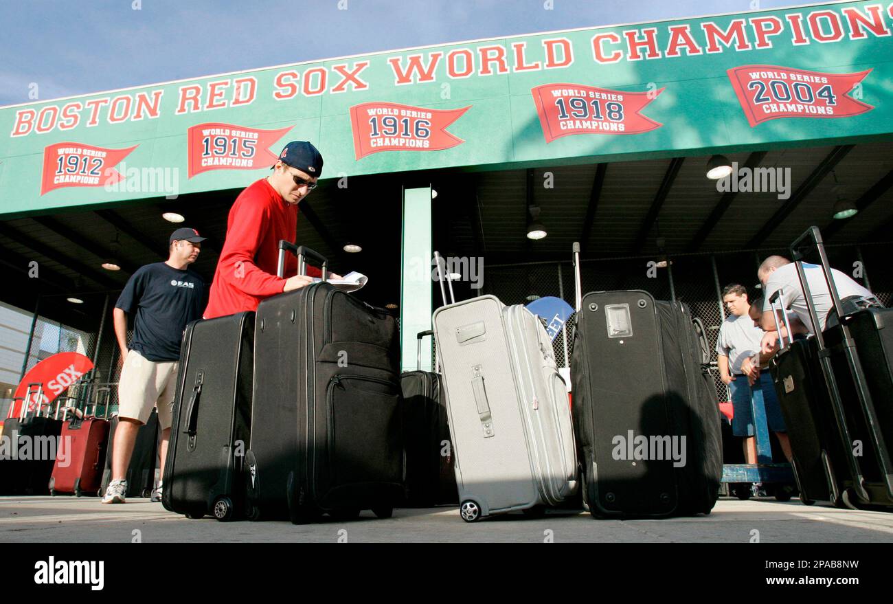 Boston Red Sox clubhouse attendant Jared Pinkos checks player's luggage  during a Spring Training baseball practice in Fort Myers, Fla., Wednesday  March 19, 2008. The Red Sox break camp in Florida after