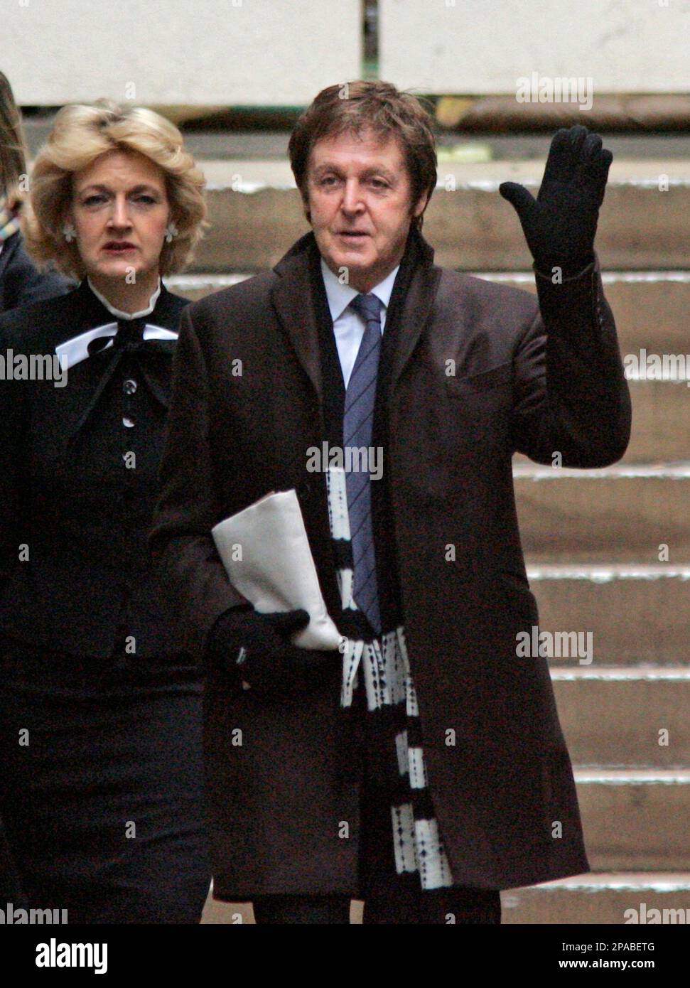 Paul McCartney, right, gestures as he arrives in central London's Royal(00)