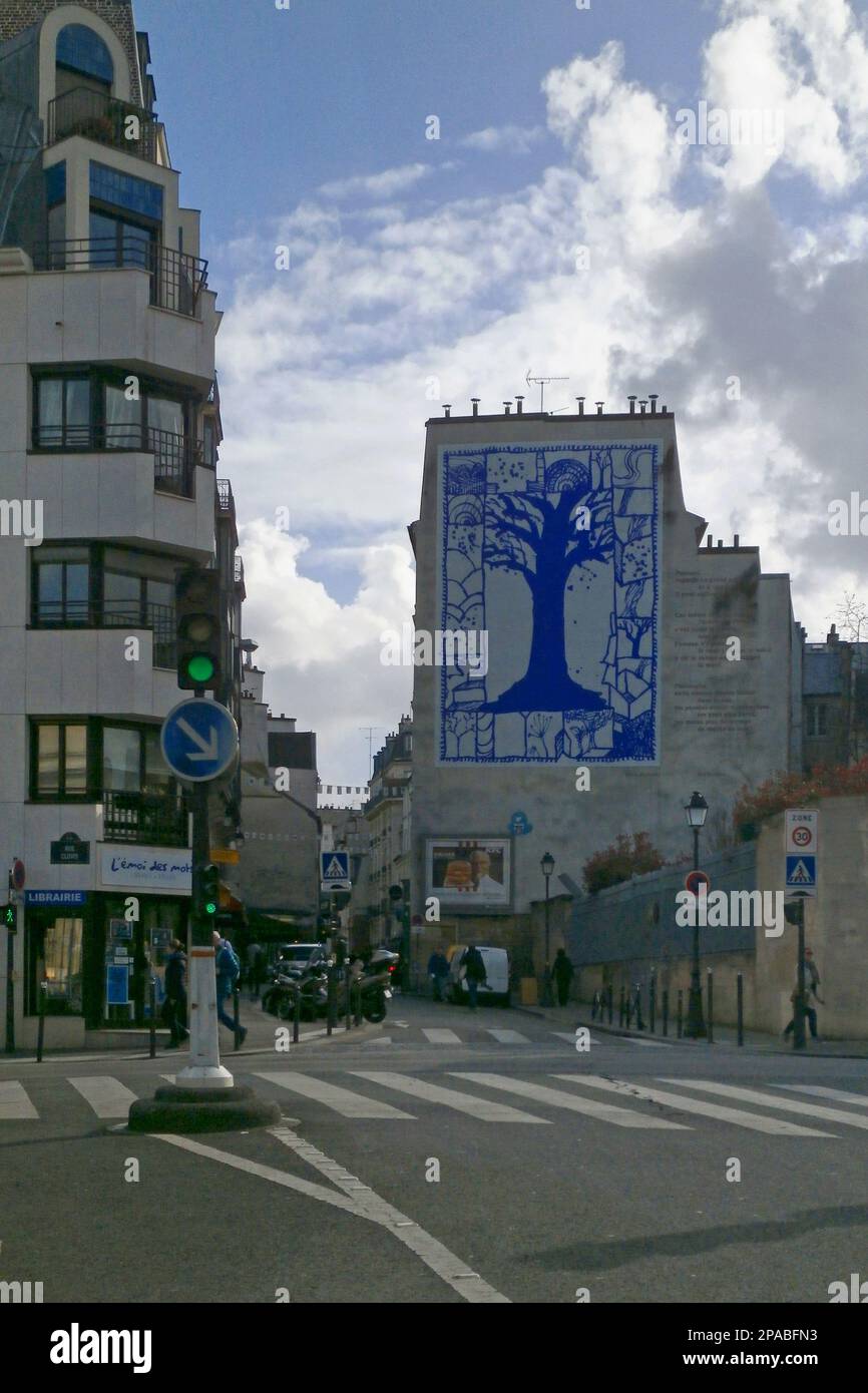 Paris, France - March 15 2018: A mural entitled 'Les insolites' (English: The Unusual) created by Pierre Alechinsky with a poem on the right side writ Stock Photo