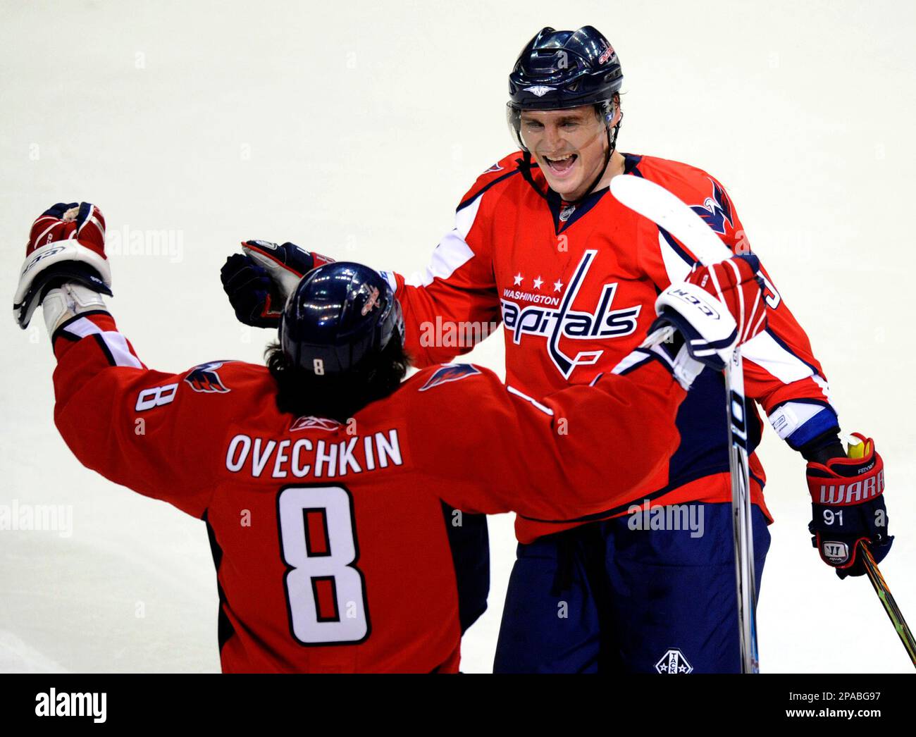 Washington Capitals Alexander Ovechkin, of Russia, is congratulated by  teammates Sergei Fedorov (91) and Mike Green (52) after scoring the game's  first goal against the Pittsburgh Penguins during first period action at