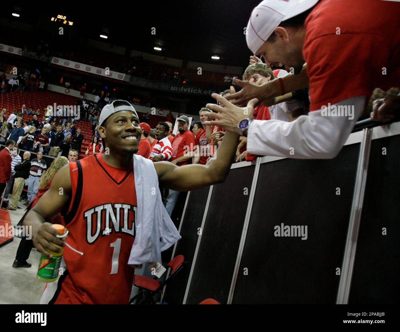 Tournament MVP Wink Adams of UNLV shakes hands with supporters