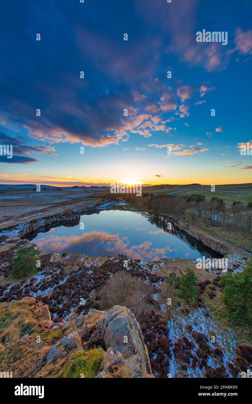 Sunset at Cawfields on Hadrian's Wall in winter looking west ...