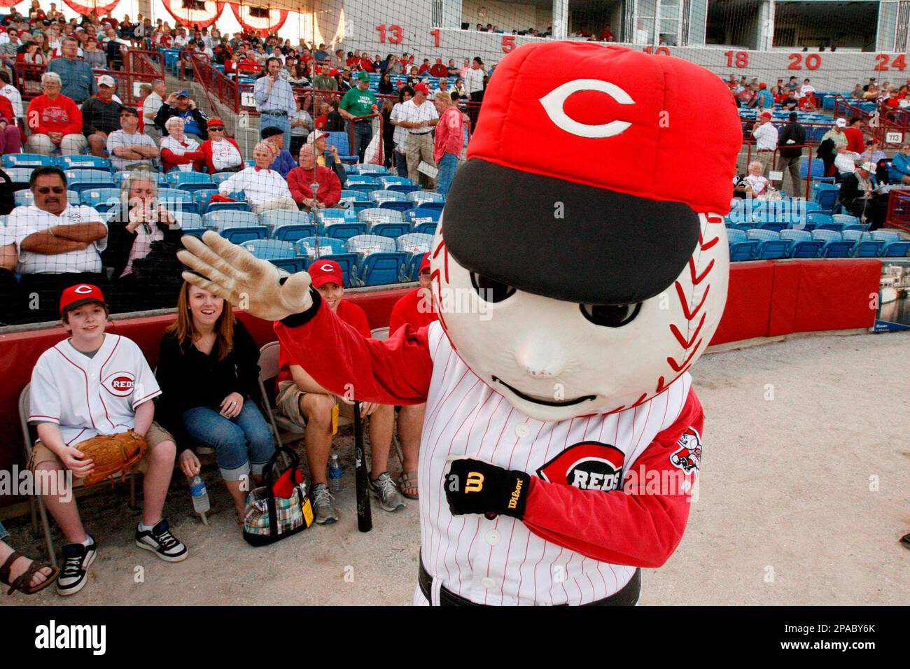 Cincinnati Reds mascot Mr. Red entertains fans before a spring training
