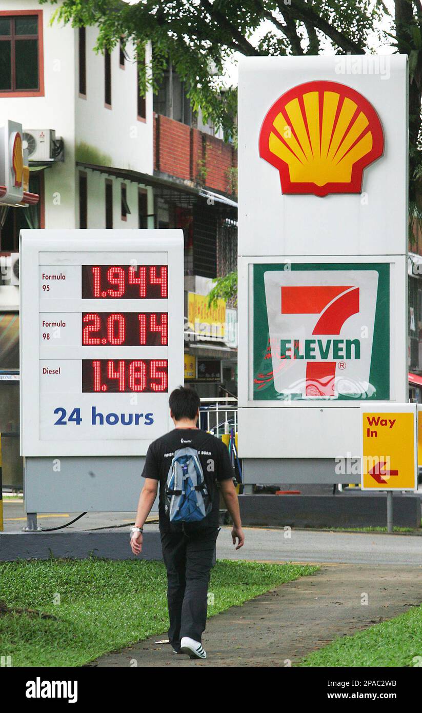 A man walks past an electronic oil price display at a gas station Thursday,  March 13, 2008 in Singapore. Oil prices on Thursday were near an overnight  record of US$110 a barrel