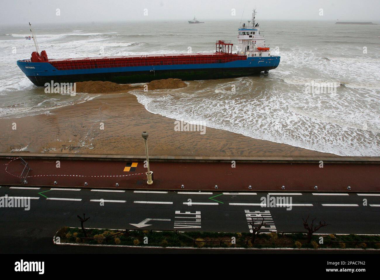 The 'Artemis', a Dutch cargo ship which ran aground Monday after high winds pushed it off course, is seen on a beach at Les Sables d'Olonne in western France, Tuesday, March 11, 2008. (AP Photo/David Vincent) Stock Photo