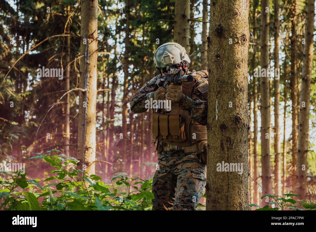 A modern warfare soldier on war duty in dense and dangerous forest ...