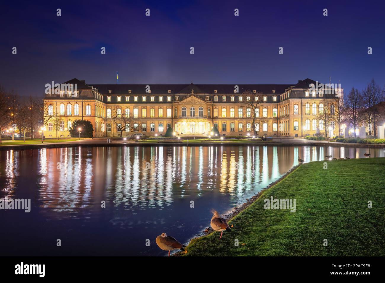 Neues Schloss (New Palace) and Eckensee lake at night - Stuttgart, Germany Stock Photo