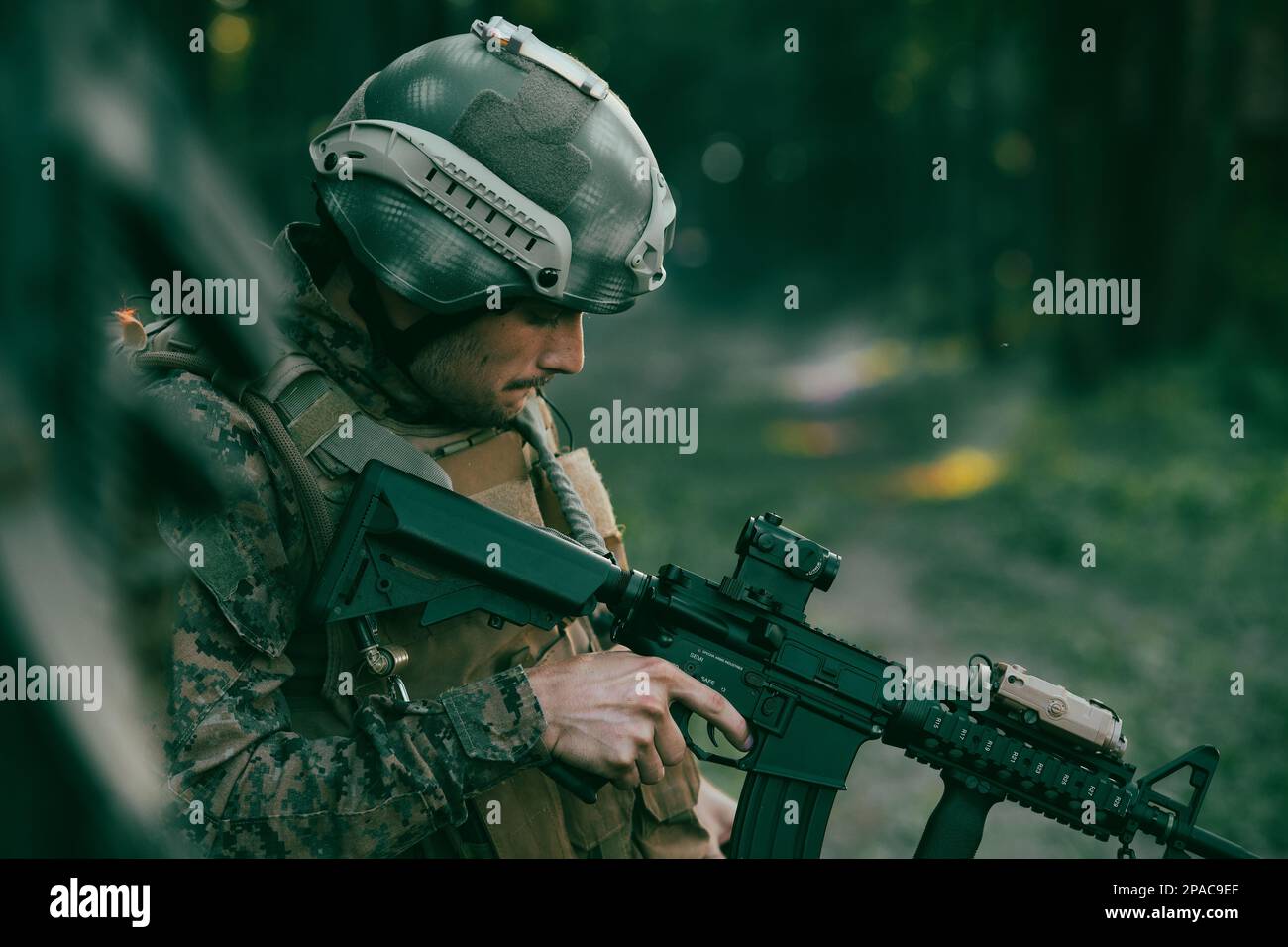 A modern warfare soldier on war duty in dense and dangerous forest ...