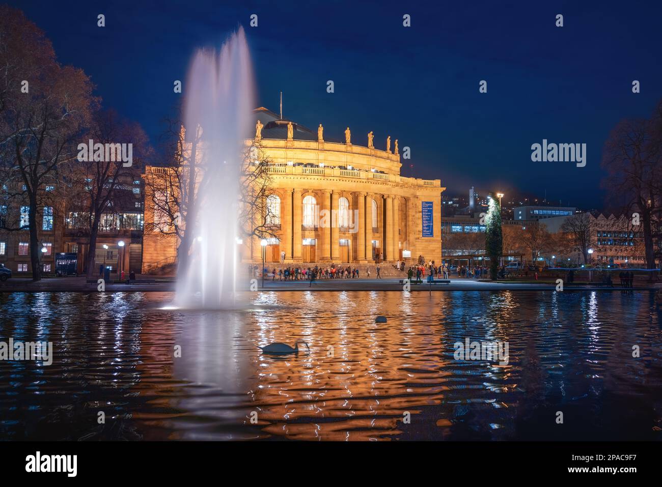 Stuttgart Opera House (Staatstheater) and Eckensee lake at night - Stuttgart, Germany Stock Photo
