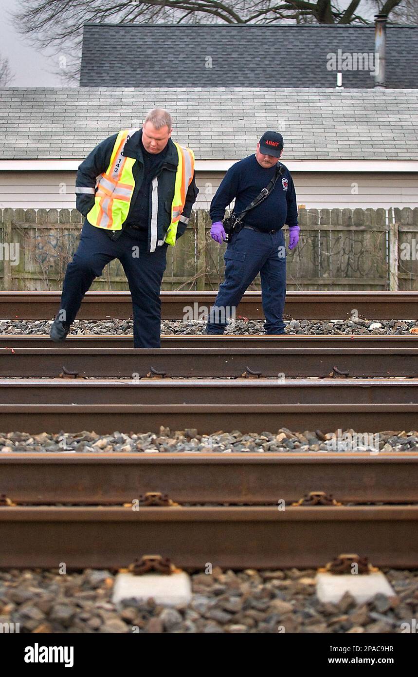 Officials investigate the scene of an accident in Croydon where a