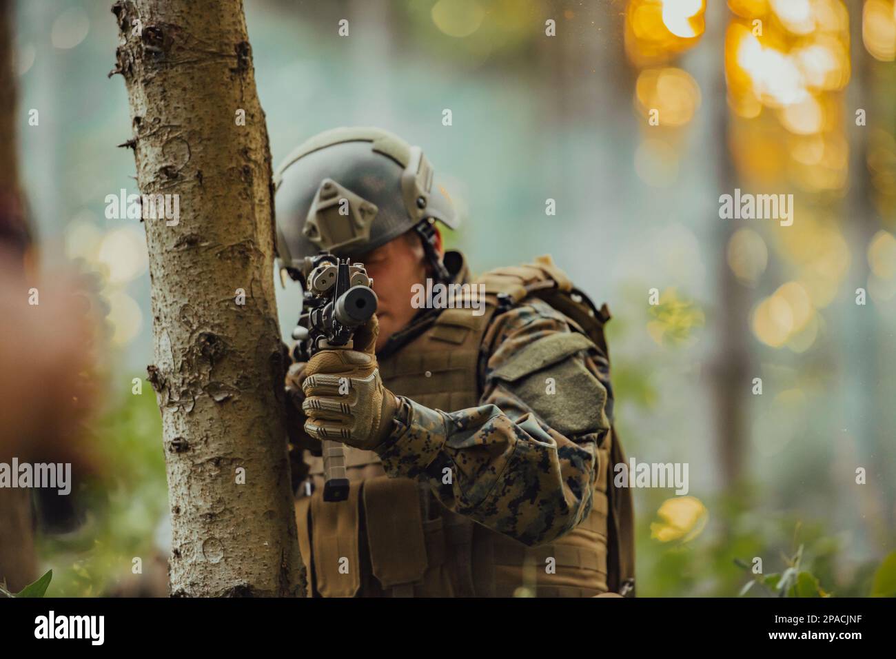 A modern warfare soldier on war duty in dense and dangerous forest ...