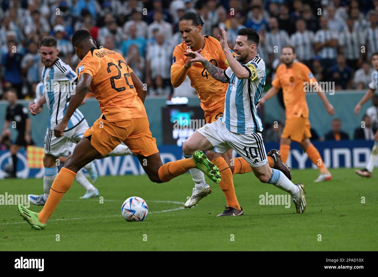 Lionel Messi (Argentina) wins a footrace against Holland's Virgil van Dijk and Denzel Dumfries in Argentina's quarter-final win in the 2022 World Cup. Stock Photo