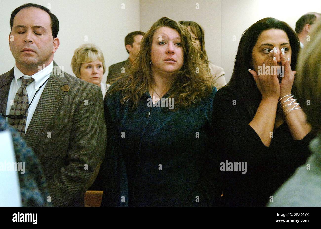 Ignacio Garraus, left, and Wendy Jones, center, the husband and sister