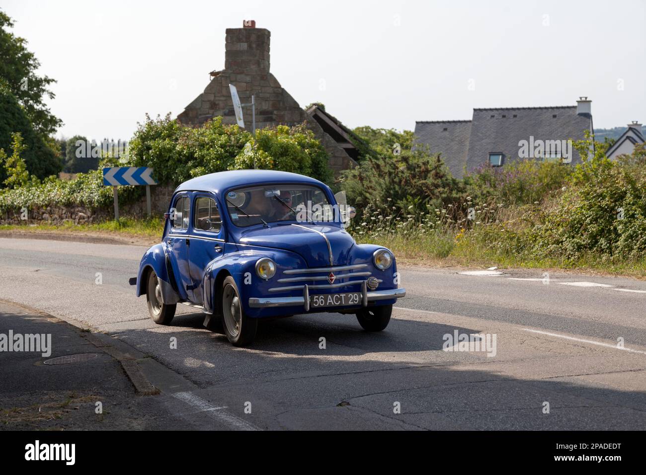 Kerlaz, France - July 17 2022: Retired man cruising in a blue Renault 4CV. Stock Photo