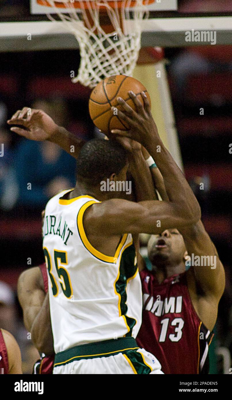 Boston Celtics' Paul Pierce (R) drives to the basket past defending Seattle  SuperSonics' Kevin Durant during the second half at the Key Arena in  Seattle on December 27, 2007. Pierce poured in 37 points to lead the  Celtics past the SuperSonics 104-96