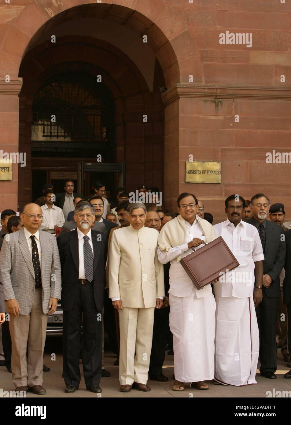 Indian Finance Minister P. Chidambaram, with briefcase in hand, walks out of the ministry building along with his team of financial advisors to present the annual budget in New Delhi, India, Friday Feb.29, 2008. (AP Photo/Saurabh Das) Stock Photo