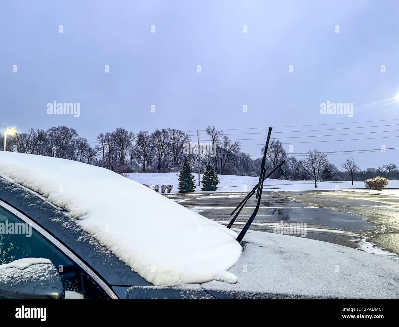 Windshield wiper raised up and icy car windshield. Leave Windshield Wipers  Up in the Ice and Snow Stock Photo by IrynaKhabliuk