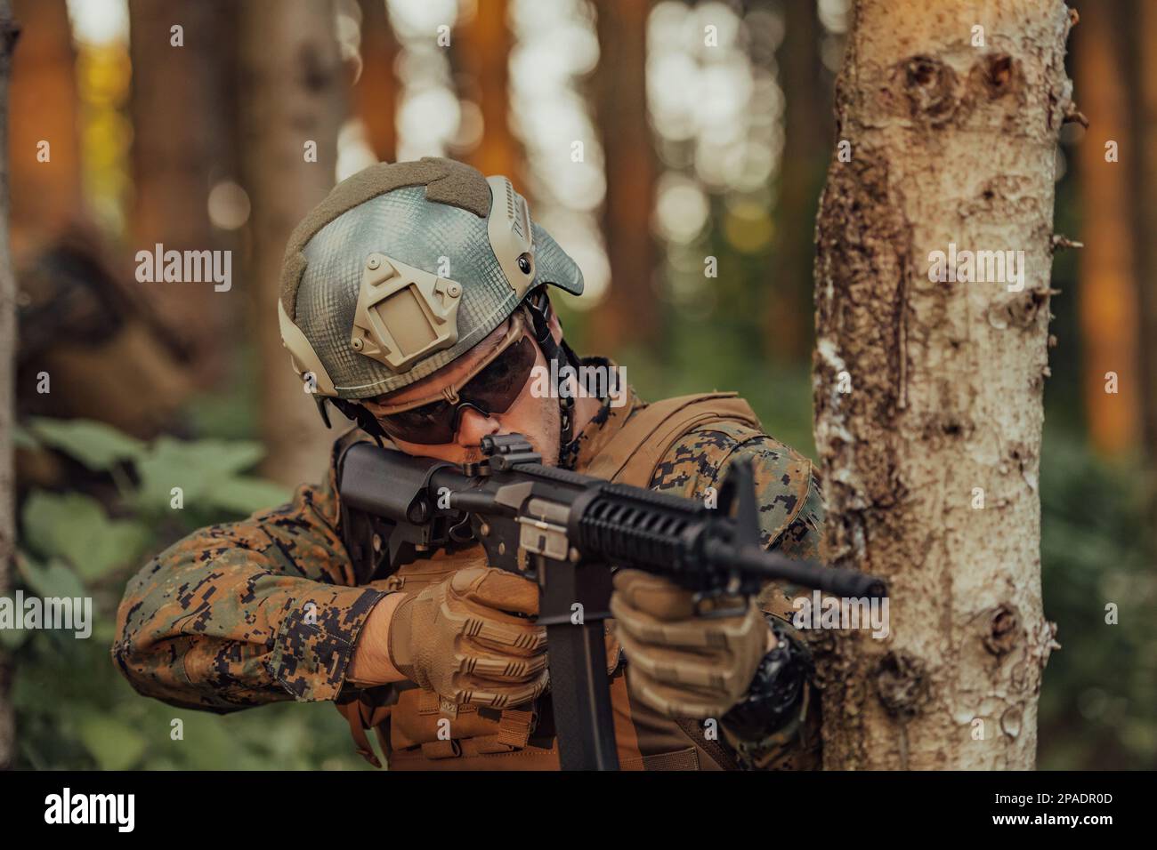 A modern warfare soldier on war duty in dense and dangerous forest ...