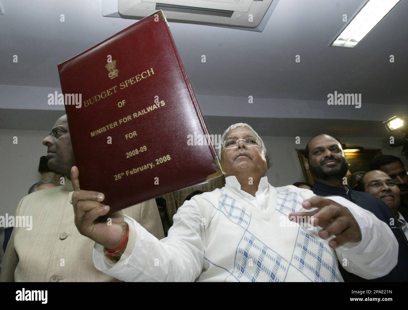 Indian Minister for Railways, Lalu Yadav holds the Railway budget for 2008-09, to be presented in Parliament on 26th February, at his office in New Delhi, India, Monday, Feb. 25, 2008. (AP Photo/Mustafa Quraishi) Stock Photo